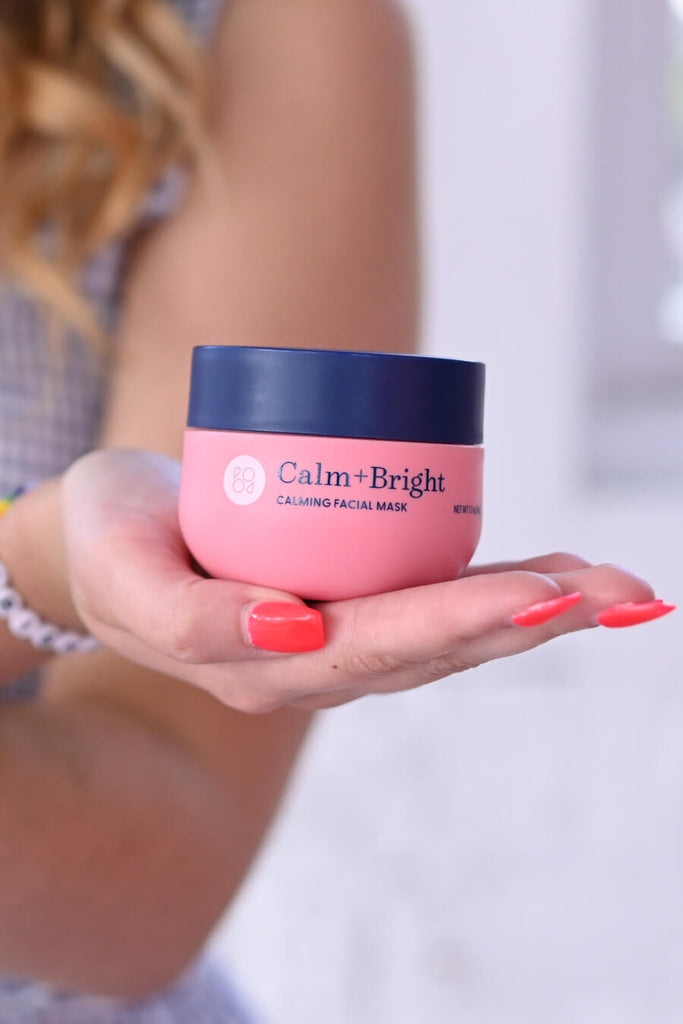 Young girl displaying Calm+Bright Calming Facial Mask on her hand